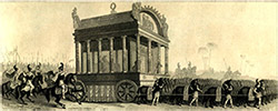 a funeral procession with a large hearse and men with horses