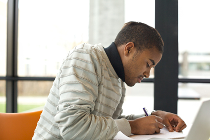 teen boy writing