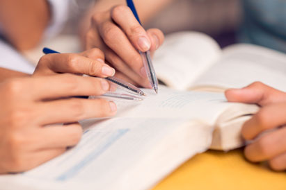 hands holding books