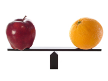 an apple and an orange on a balanced scale