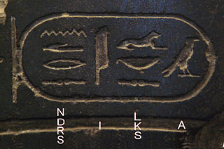 hieroglyphic characters carved on a slab of stone